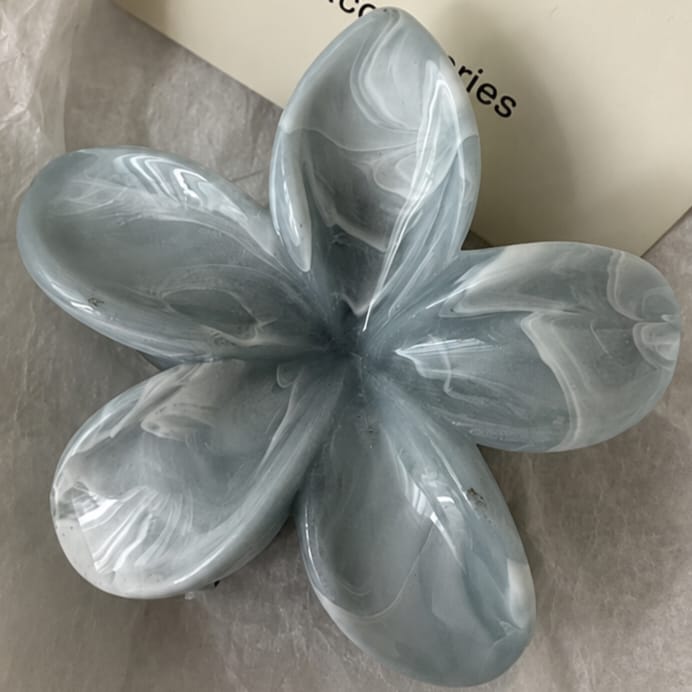 flower shaped hair claw clip with marble texture and smooth glossy finish stylish design