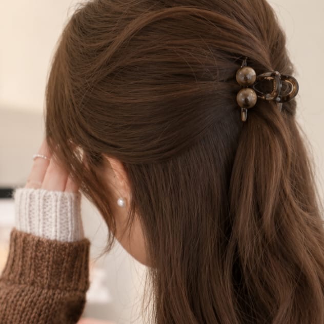 brown hair claw clip with pearl embellishments and smooth polished design stylish accessory
