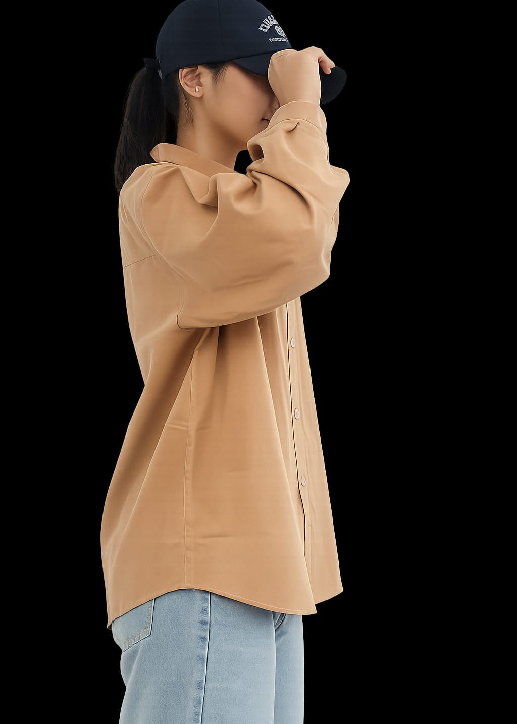Model wearing brown 100% cotton button-down shirt with a clean minimal style by NUR, perfect for smart casual and everyday wear
