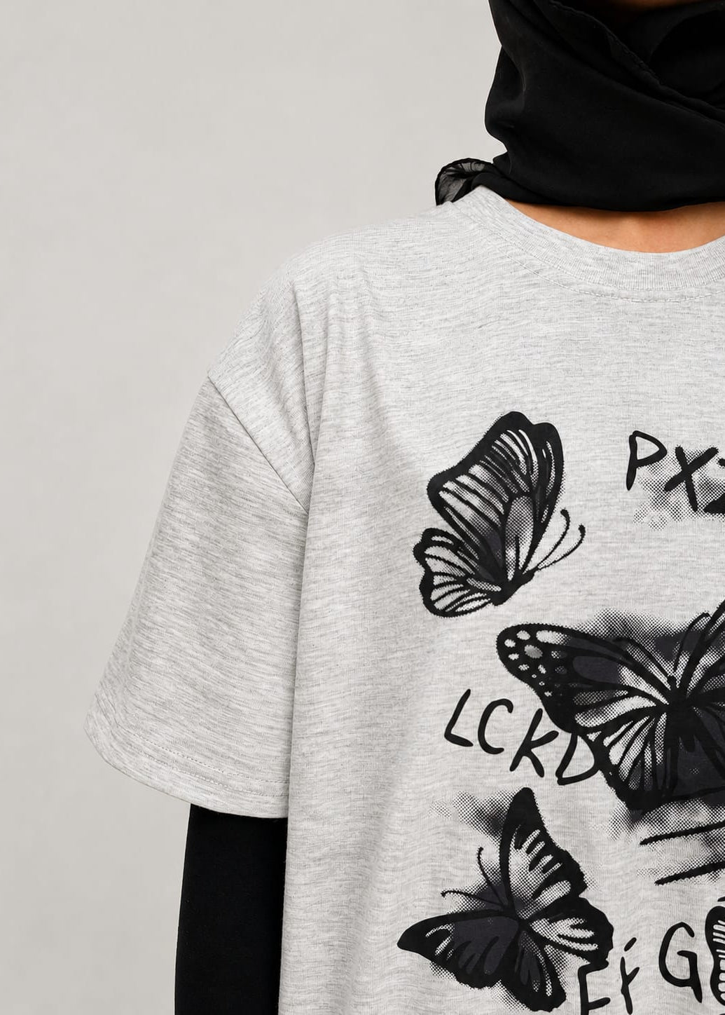 Model wearing grey cotton t-shirt with a relaxed fit and modern everyday style by NUR
