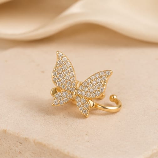 close up of butterfly crystal ear cuff showing intricate butterfly wings with sparkling crystal accents