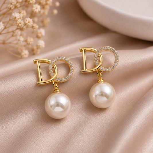 crystal pearl monogram drop earrings styled to highlight elegant drop design with pearls and crystals