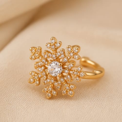 close up of snowflake crystal ear cuff showing intricate snowflake pattern with shimmering crystal accents