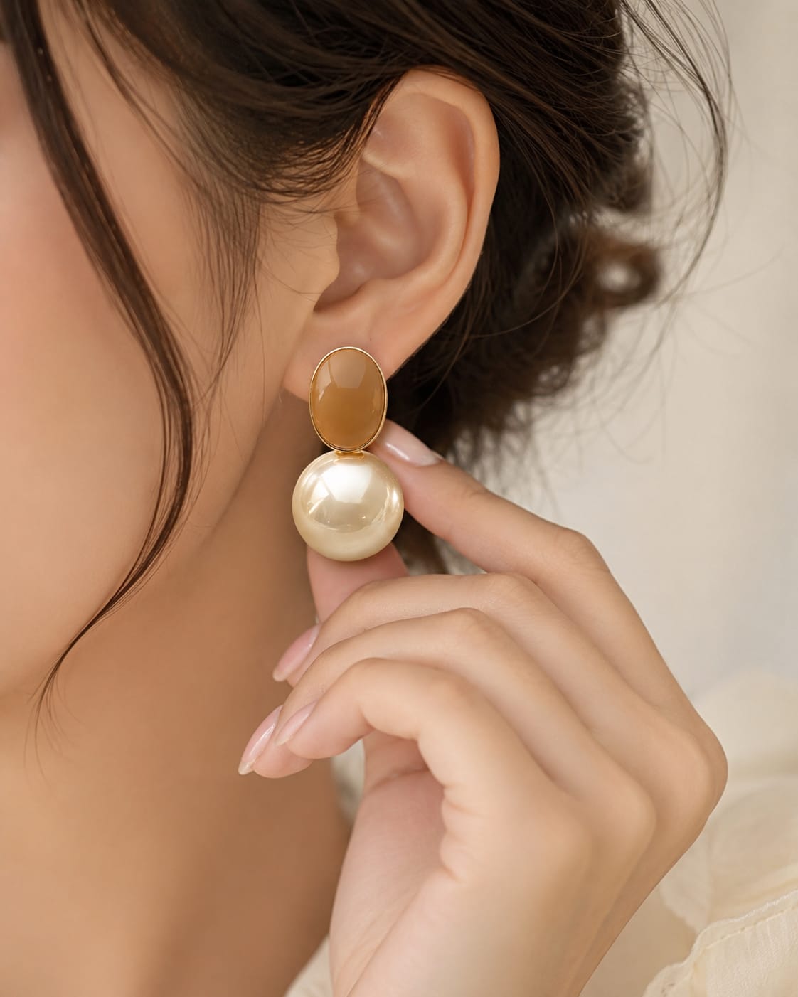 close up of pearl drop statement earrings showing lustrous pearls and refined drop silhouette