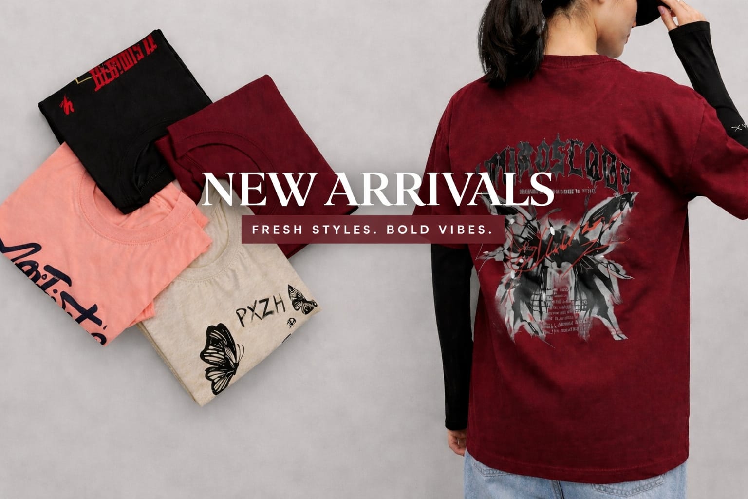 Collection of stylish t-shirts in black, red, beige, and peach colors with graphic prints, alongside a model wearing a red oversized graphic t-shirt showcasing new arrivals.