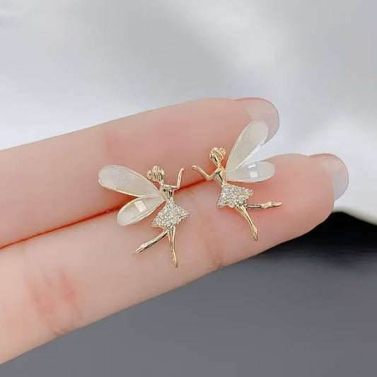 close up of fairy wing earrings showing intricate wing shape with soft sparkling accents
