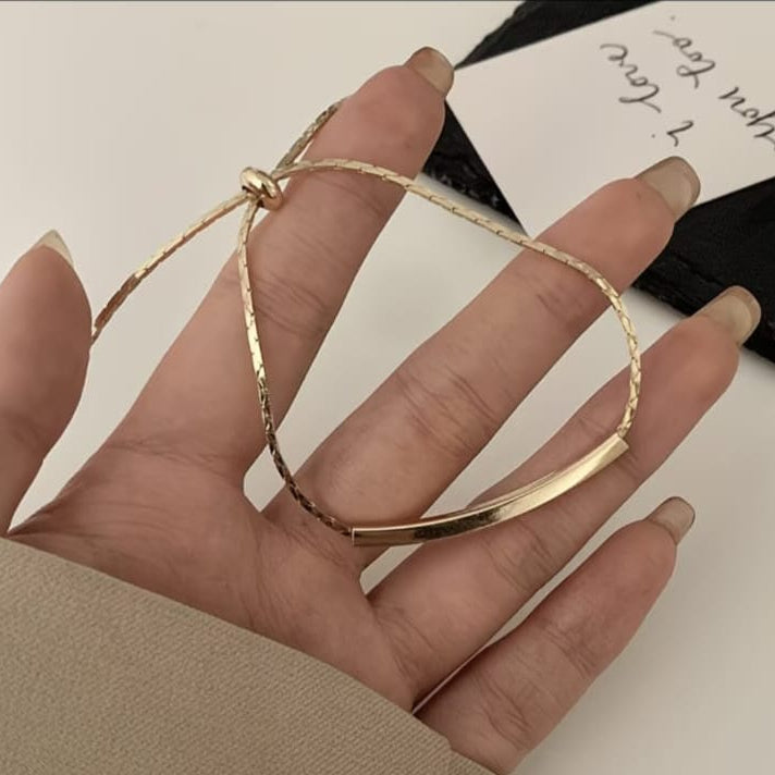 gold adjustable bar bracelet with sleek horizontal bar design on delicate chain minimal style