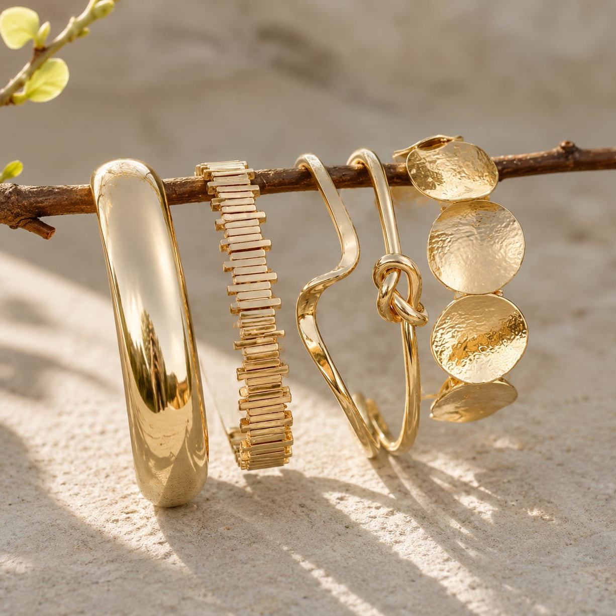gold organic cuff bangle styled on wrist highlighting bold and contemporary statement design