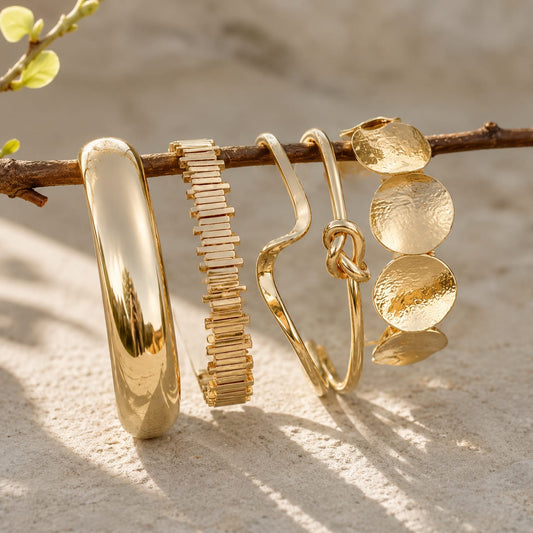 gold organic cuff bangle styled on wrist highlighting bold and contemporary statement design