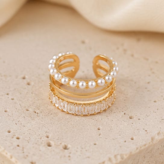 close up of pearl layered ear cuff showing delicate stacked pearls with refined finish