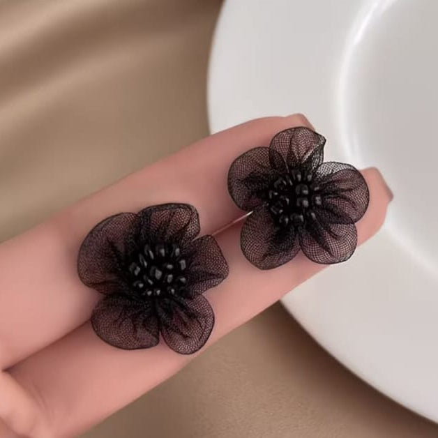 midnight bloom mesh flower stud earrings styled to highlight bold yet delicate flower silhouette
