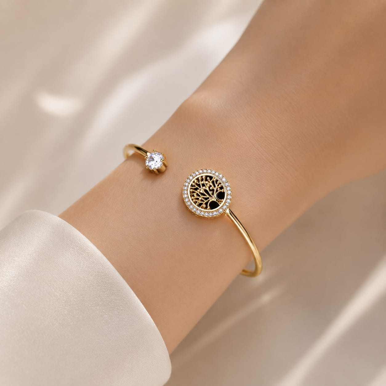 close up of gold tree of life cuff bracelet showing detailed design and shimmering crystal accents