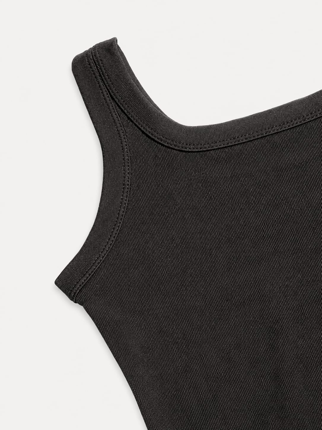 black ribbed tank top with a fitted stretch design and modern everyday style by NUR