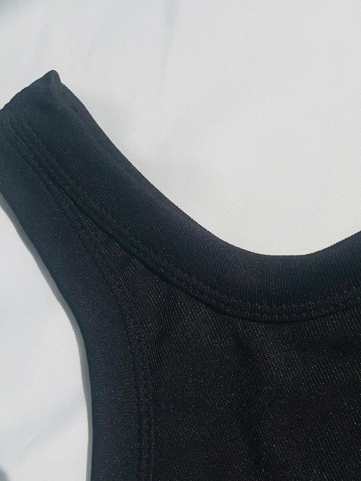 black ribbed tank top with a fitted stretch design and modern everyday style by NUR