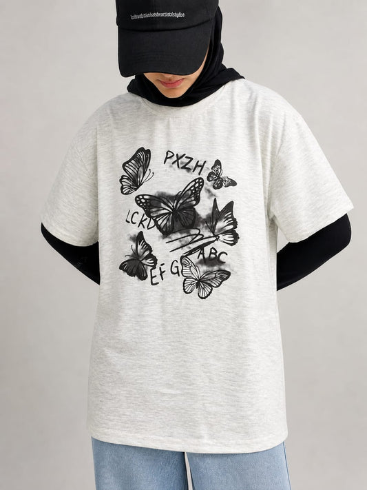 Model wearing grey cotton t-shirt with a relaxed fit and modern everyday style by NUR