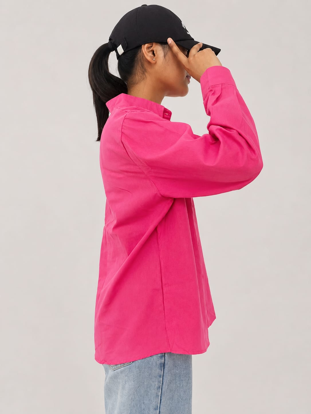 Model wearing soft pink 100% cotton button-down shirt with a clean minimal style by NUR