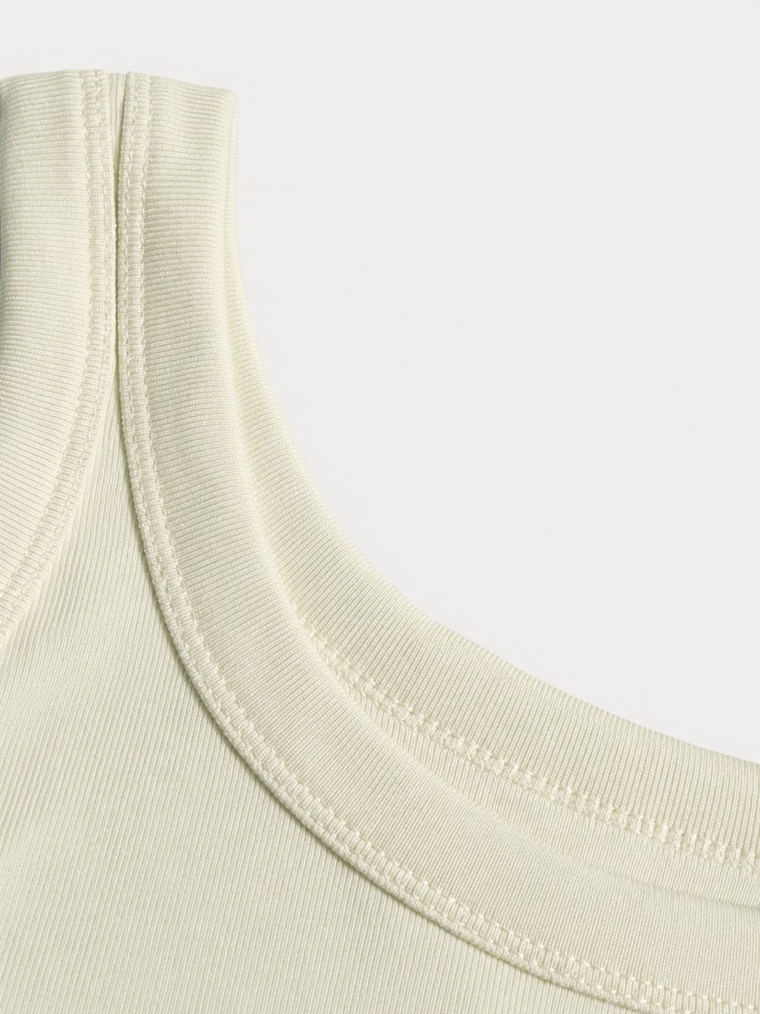 white ribbed tank top with a fitted stretch design and modern minimal style by NUR